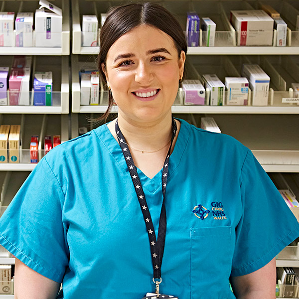 Female pharmacist smiling at camera